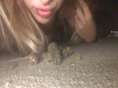 Blonde chick tasting a nasty poop in a public place